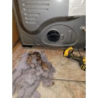 This is a pile of burnt lint build-up that was luckily removed before causing a further fire hazard. This is the back of the dryer. 