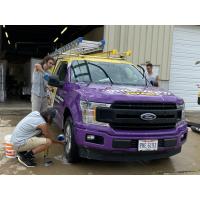 Our team of techs washing one of our trucks, ensuring we are ready to head out and service more dryer vents!