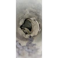 Inside of a dirty, lint filled dryer vent. 